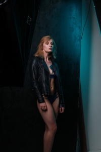 Grungy black background with teal gel lighting